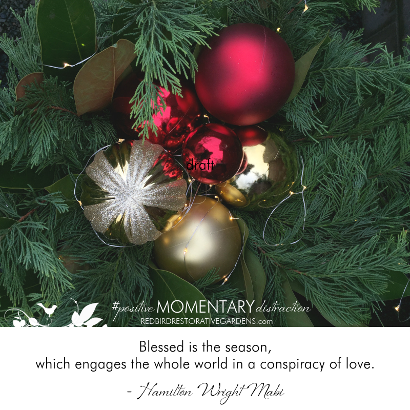 holiday ornaments in greenery